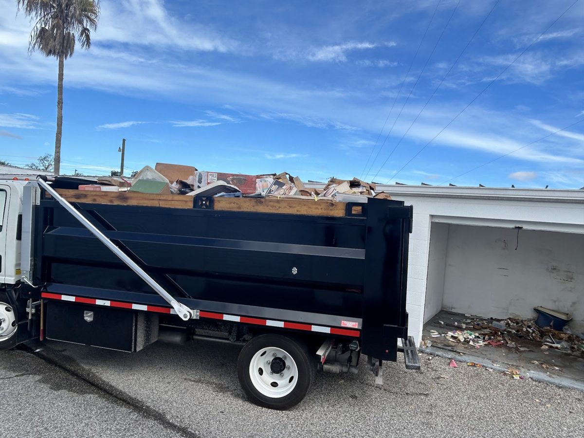 A loaded Manatee Junk Bros truck after a cleanout